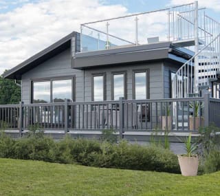 The exterior of our stunning Luxury Lodge with a roof terrace at Swanage Bay View, Dorset. Book your holiday now! image