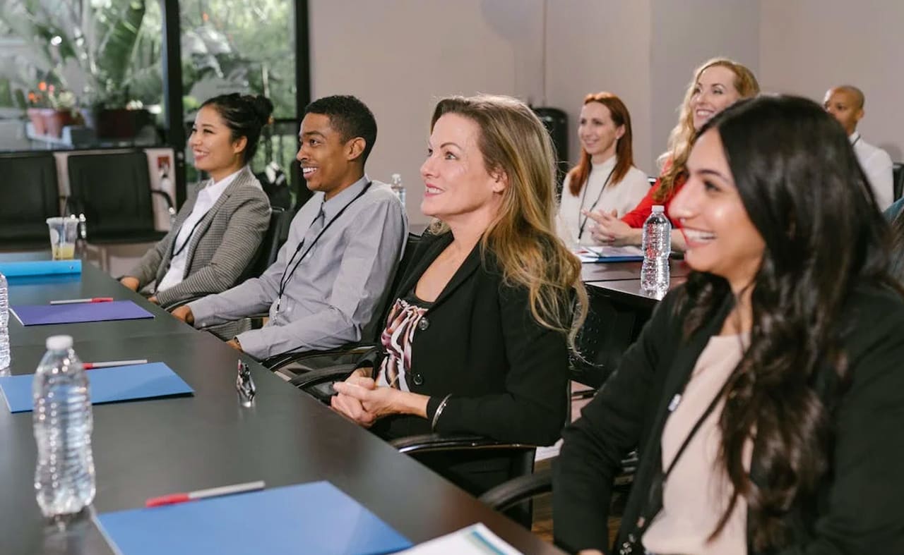 A group of people attending a conference meeting. image