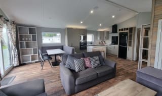 The living and lounge area of one of our exclusive accommodations, The Seaview Lodge. Book your holiday now! image