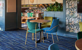 Seating area inside the Tipsy Eagle Bar at Appletree Holiday Park. image