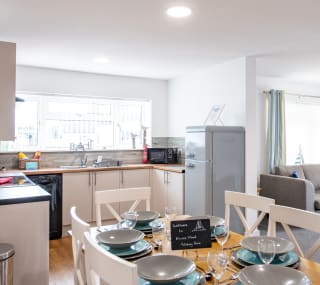 The kitchen and dining area of one of our spacious static caravans at Mersea Island. Book your holiday now! image