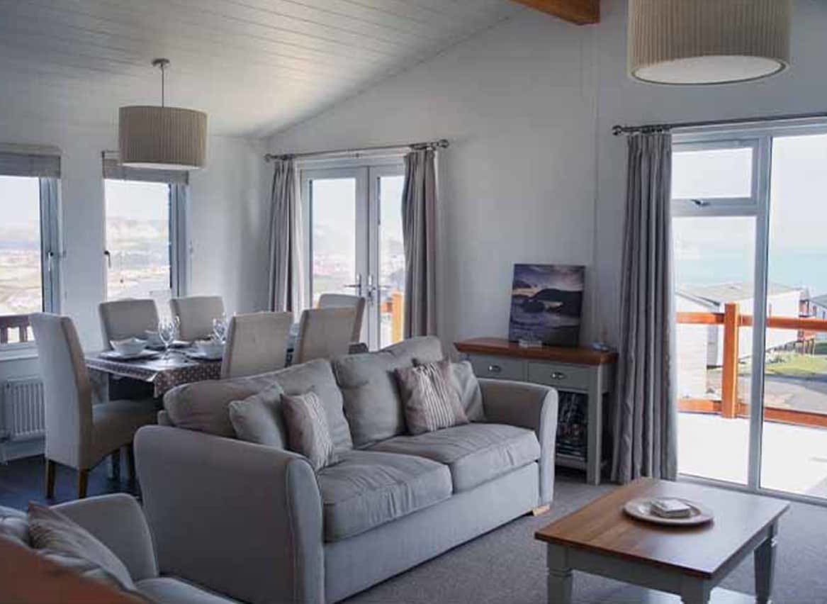 The living area of our bright and spacious Superior Lodge with stunning seaviews. The perfect way to stay. image