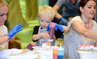 A young boy taking part in our tie dye activity. image