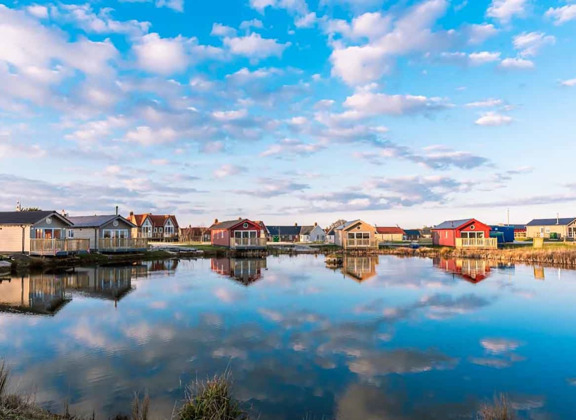 Holiday lodges looking out to a lake at The Bay Filey, Yorkshire, Away Resorts. image