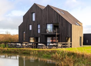 Exterior of our exclusive barn accommodation overlooking our lakes. image