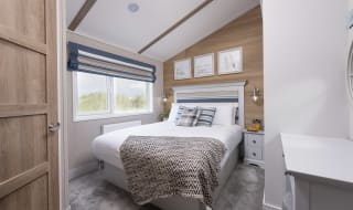The double bedroom of one of our spacious static caravans in St Ives. Book your holiday now! image