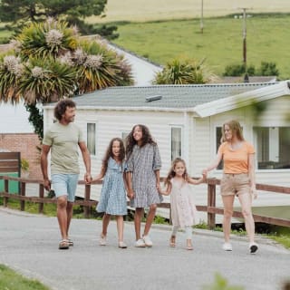 Family walking around our Newquay Bay Holiday Park. image