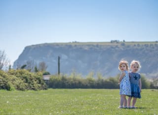 Children playing besides Whitecliff Bay views image