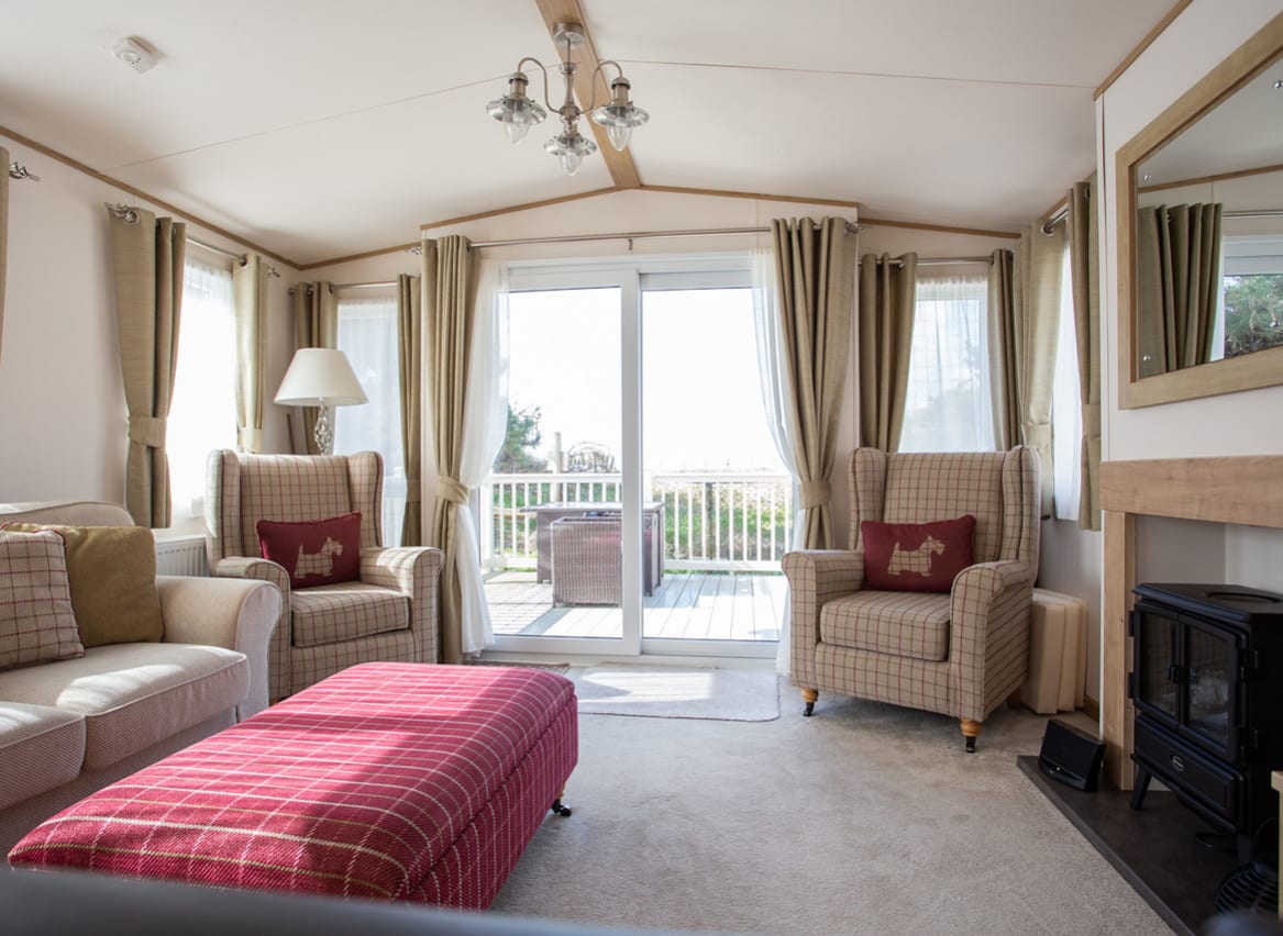 The lounge area of our bright and spacious indulgent static caravan. The perfect way to stay. image