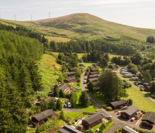 An aerial shot of a selection or holidays homes at Away Resorts Glendevon Residential Park, perched in stunning scenery.