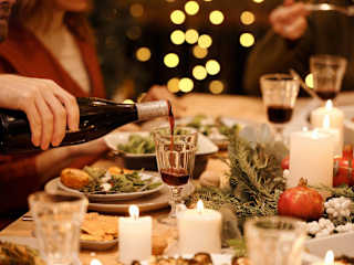 A close up of people enjoying a Christmas dinner
