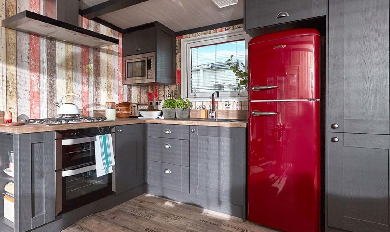 The kitchen area of one of our exclusive accommodations, The TriBeCa. Book your holiday now! image