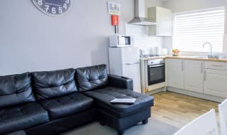 The living and kitchen area of our bright and cosy comfort chalet. The perfect way to stay.