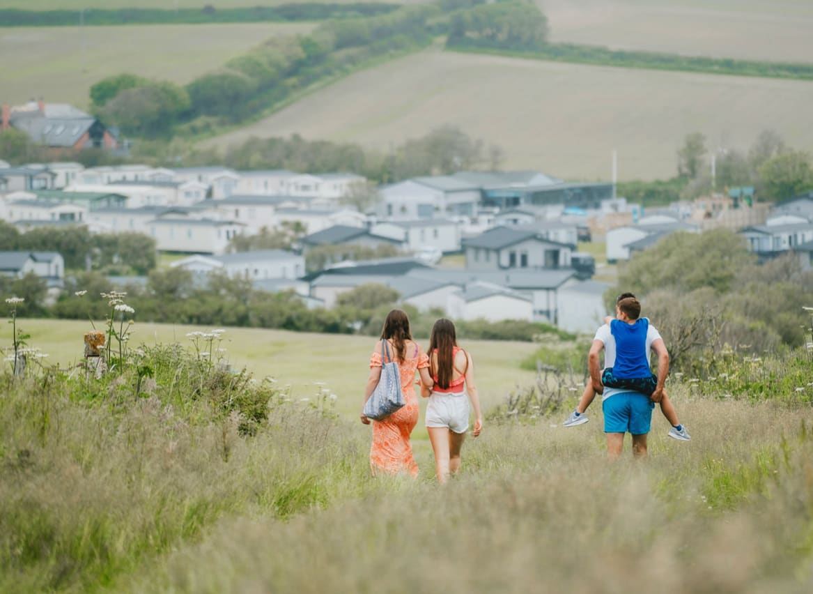 Family walking towards our holiday resort in Cornwall, Bude. image