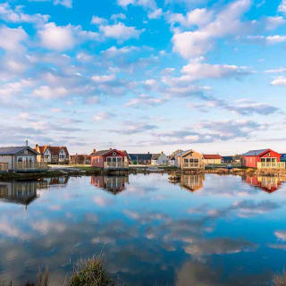 Holiday lodges looking out to a lake at The Bay Filey, Yorkshire, Away Resorts.