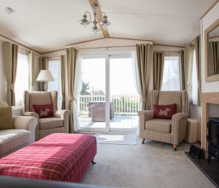 The lounge area of our bright and spacious indulgent static caravan. The perfect way to stay.