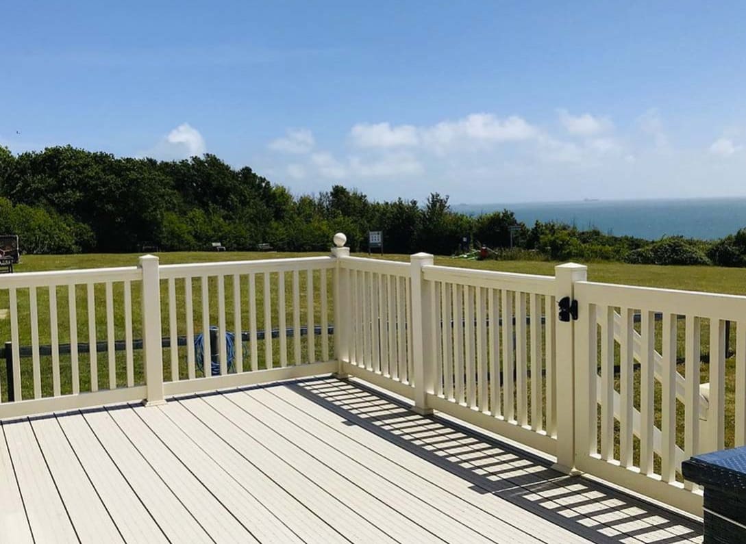 The decking area on a sunny day at one of our exclusive accommodations, The Seaview Lodge. Book your holiday now! image