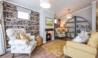 The lounge area of our bright and spacious luxury rooftop lodge at Swanage Bay View. The perfect way to stay. image