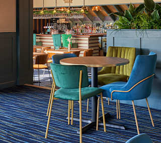 Seating area inside the Tipsy Eagle Bar at Appletree Holiday Park. image