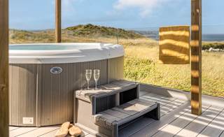 A bright sunny day at our St Ives park with stunning views from our hot tubs. image