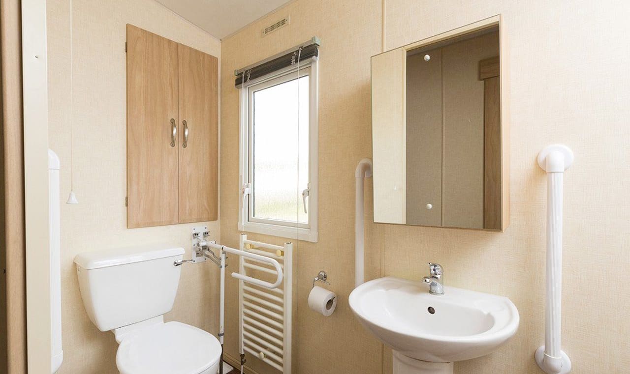 The bathroom of our accessibility adapted static caravan. The perfect way to stay. image