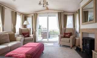 The lounge area of our bright and spacious indulgent static caravan. The perfect way to stay. image