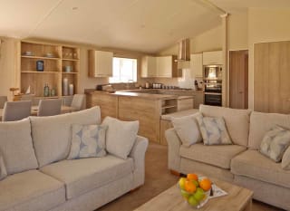 The living area of one of our spacious lodges. Book your holiday now! image