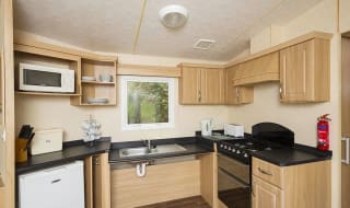 The kitchen area of our accessibility adapted static caravan. The perfect way to stay. image