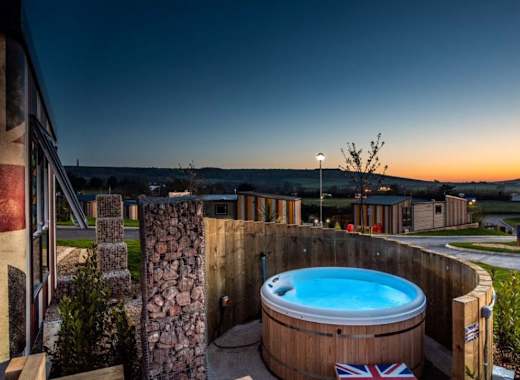 Accommodation with hot tub at sunset