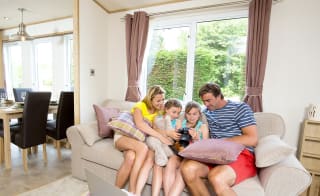 A family enjoying the lounge in our holiday home. image
