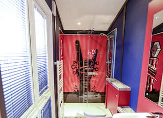 The shower and bathroom of one of our exclusive accommodations, The Rockstar. Book your holiday now! image