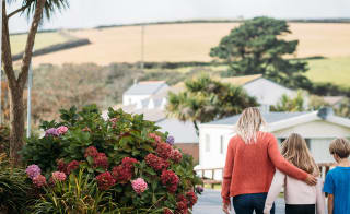 Family visiting Newquay Bay Holiday Park during the autumn months. image