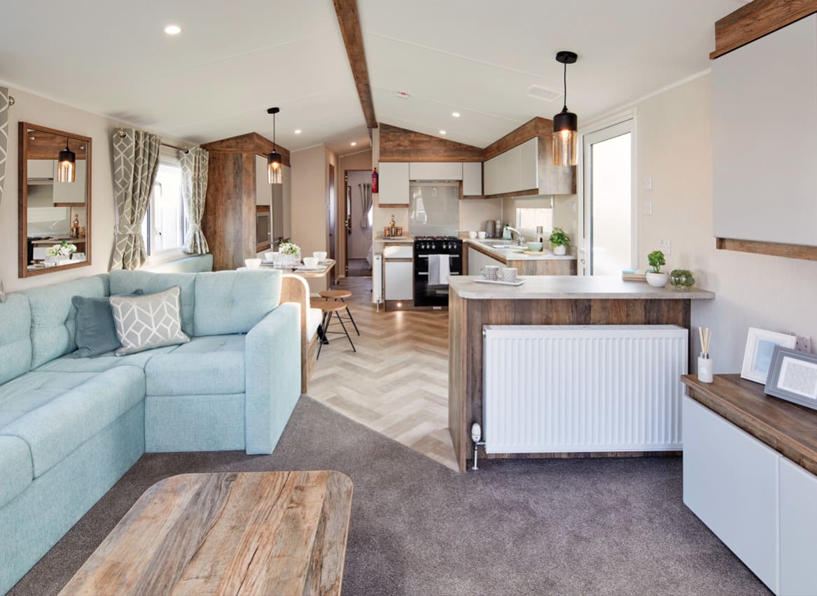 The living and dining area of one of our spacious holiday homes to buy in St Ives. Enquire today! image