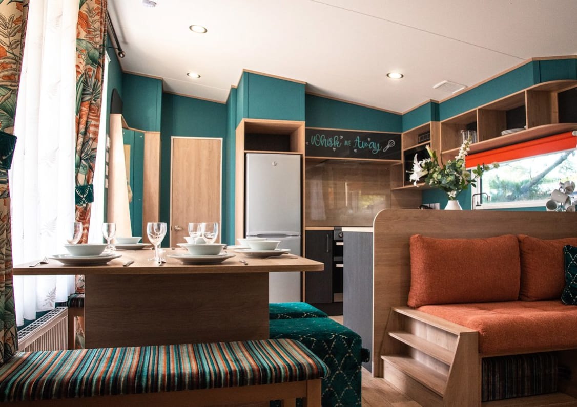 The living and dining area of our bright and spacious Exclusive accommodation, The Burst of Blue. The perfect way to stay.
