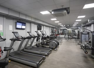 An image of the gym at our Dorset holiday park, Swanage Bay View. There are treadmills, bike machines, weights and so much more! image