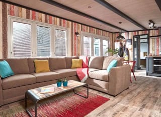 The living area of one of our exclusive accommodations, The TriBeCa. Book your holiday now! image