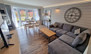 The lounge area of our stunning holiday home at The Lakes Rookley, the Island Cottage. image