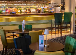 The seating and bar area at The Six West Bar & Eatery at Appletree Holiday Park, Lincolnshire. image