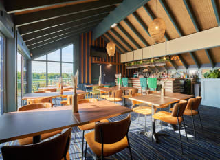 Seating area inside the Tipsy Eagle Bar at Appletree Holiday Park. image