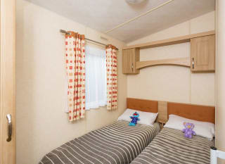 The twin bedroom of our accessibility adapted static caravans. The perfect way to stay. image