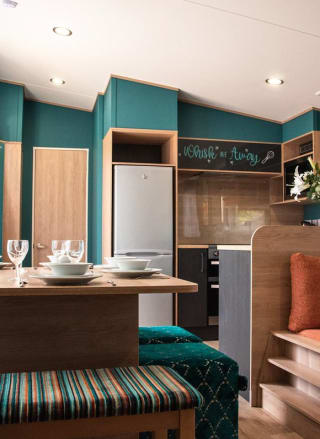 The living and dining area of our bright and spacious Exclusive accommodation, The Burst of Blue. The perfect way to stay.