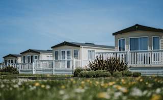 A row of caravans on a summers day at our stunning Cornish park, Newperran. image