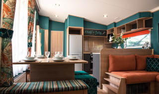 The living and dining area of our bright and spacious Exclusive accommodation, The Burst of Blue. The perfect way to stay. image