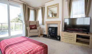 The lounge area of our bright and spacious indulgent static caravan. The perfect way to stay. image