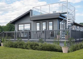 The exterior of our stunning Luxury Lodge with a roof terrace at Swanage Bay View, Dorset. Book your holiday now!