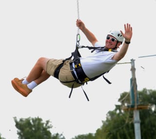 A man enjoying the zip wire activity at Tattershall Lakes. image