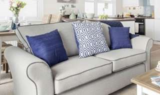 The lounge area of one of our lodges at Bude. image