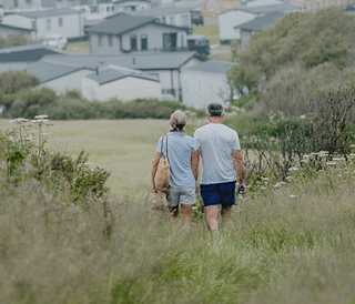 Couple on their walk near Bude Holiday Park during the autumn months.