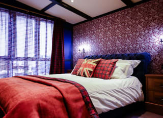 The master bedroom of one of our exclusive accommodations, The Rockstar. Book your holiday now! image
