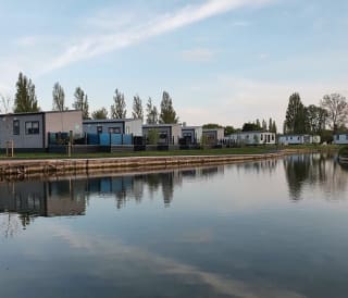 A view of our stunning holiday homes over the lake at Mill Rythe, Hampshire.